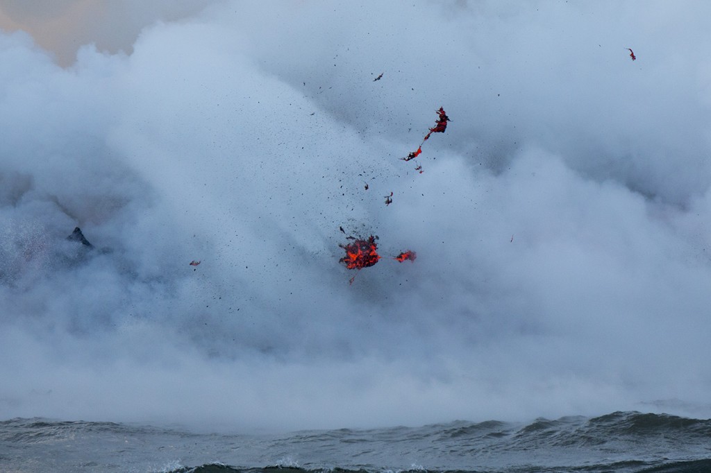 Spatter flies around in an explosion, 61g lava flow ocean entry, Kalapana, Big Island of Hawai'i, USA