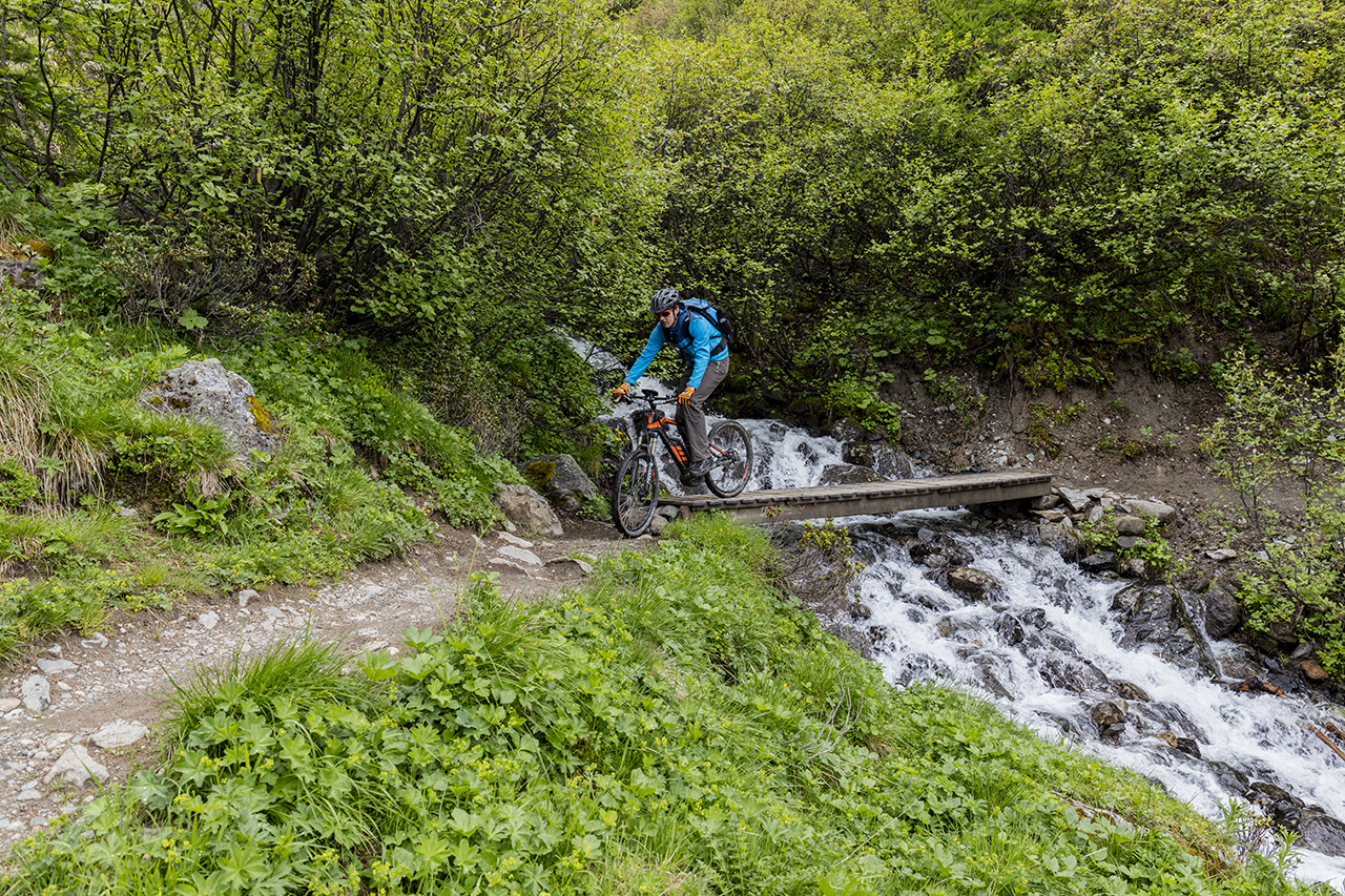 Water crossing on the Alps Epic Bike Trail near Rinerhorn, Davos, Switzerland