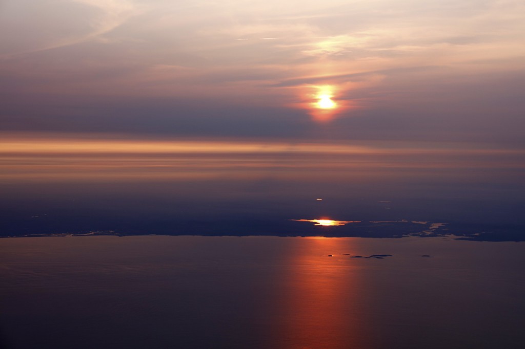 Sunset over the Massachusetts Atlantic coastline on approach to Boston's Logan Airport