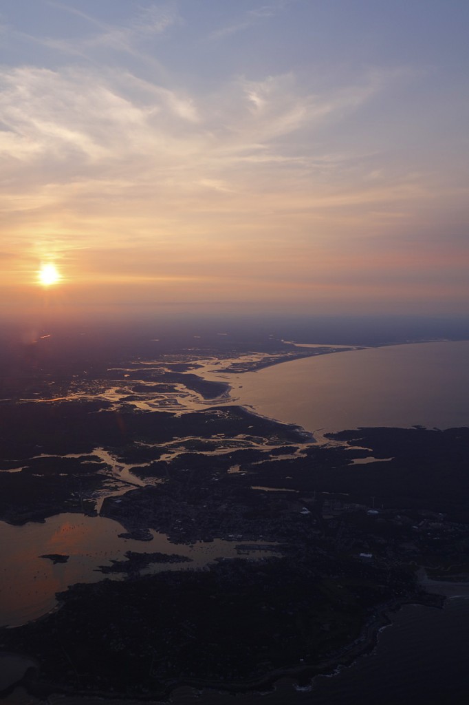 Sunset over the Massachusetts Atlantic coastline on approach to Boston's Logan Airport