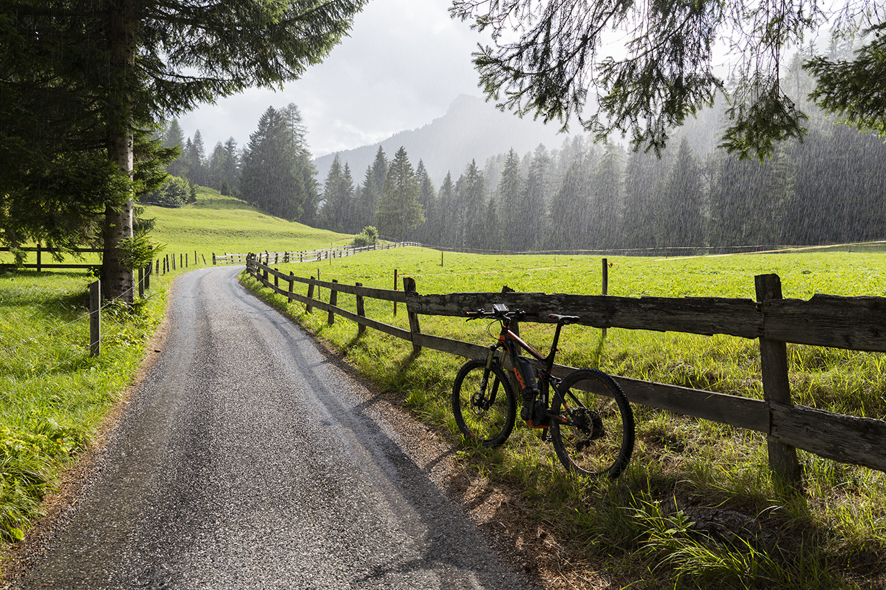 Rain falls onto Kunkelpass road during a thunderstorm, Tamina valley, Switzerland