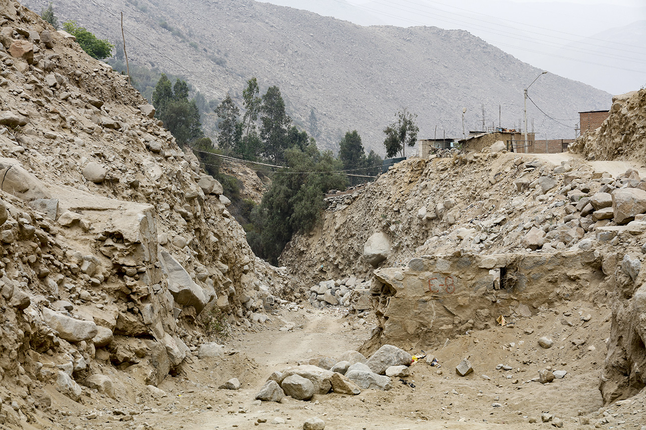 Debris flow broken through a barrier, Chosica, Lima, Peru