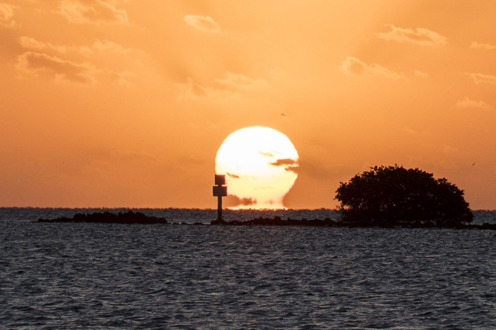 Sun reflection on horizon, Biscayne Bay, Florida, USA