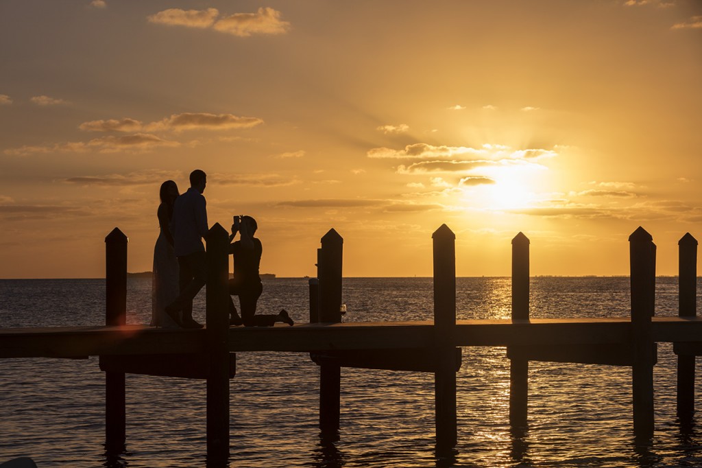 People watching the sunset on the pier, Key Largo, Florida, USA